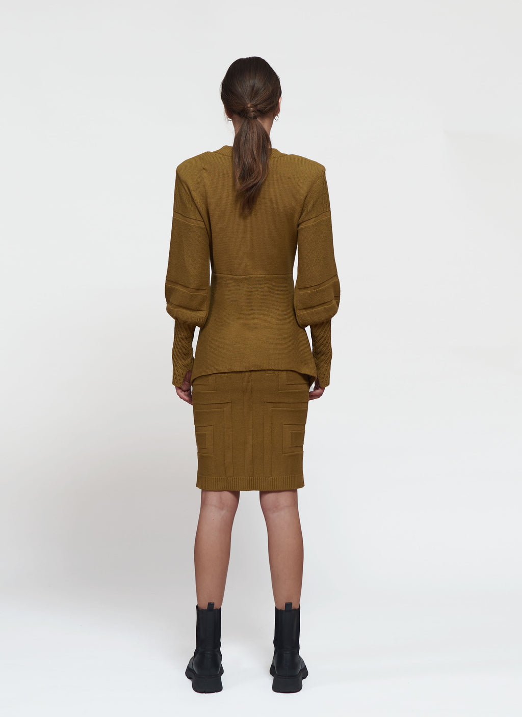 Primakind Kaya Shoulder-padded, two-piece knitwear with a pencil skirt.