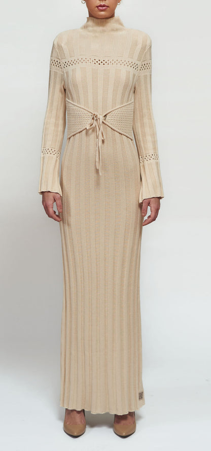 Pleated knitwear with a mock neck, flared sleeves, and an adjustable side corset