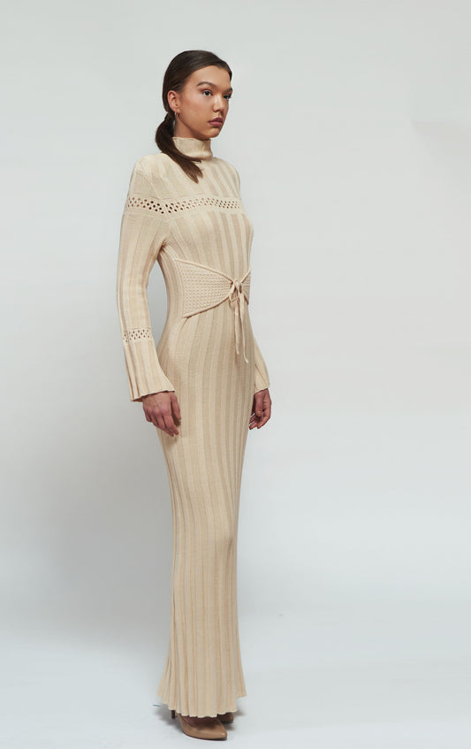 Pleated knitwear with a mock neck, flared sleeves, and an adjustable side corset
